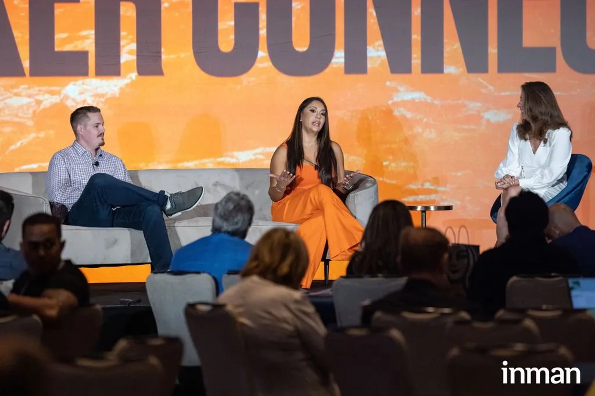 Ian S. Hoover on stage at Inman Connect, seated on a panel in front of a copper CONNECT backdrop.